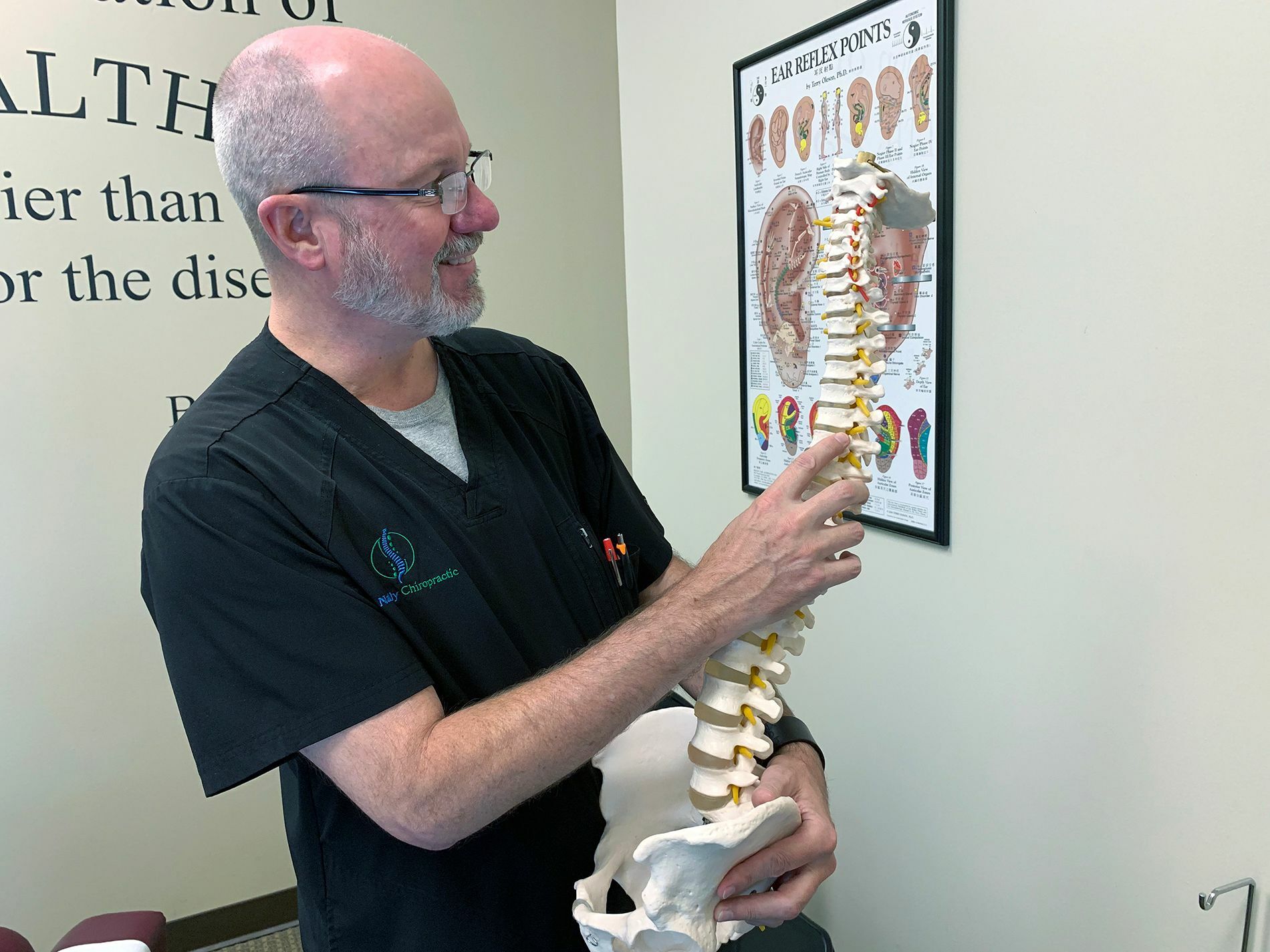 Chiropractor-Parker-CO-Scott-Godsey-Holding-Spine.jpeg